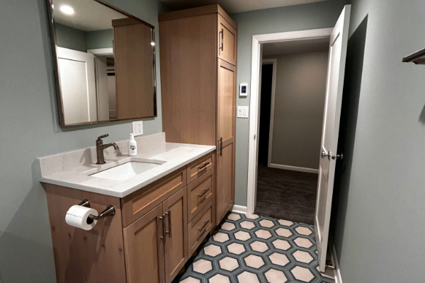 modernized bathroom with sink, toilet, and new shower in Park Ridge