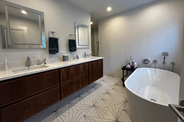 bathroom in Hinsdale with new sink, tub, and mirror