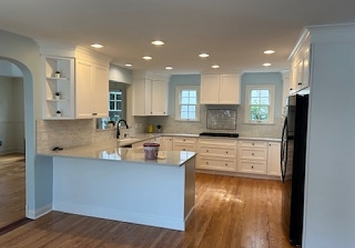 kitchen area with new stove, fridge, sink, and cabinetry in Park Ridge